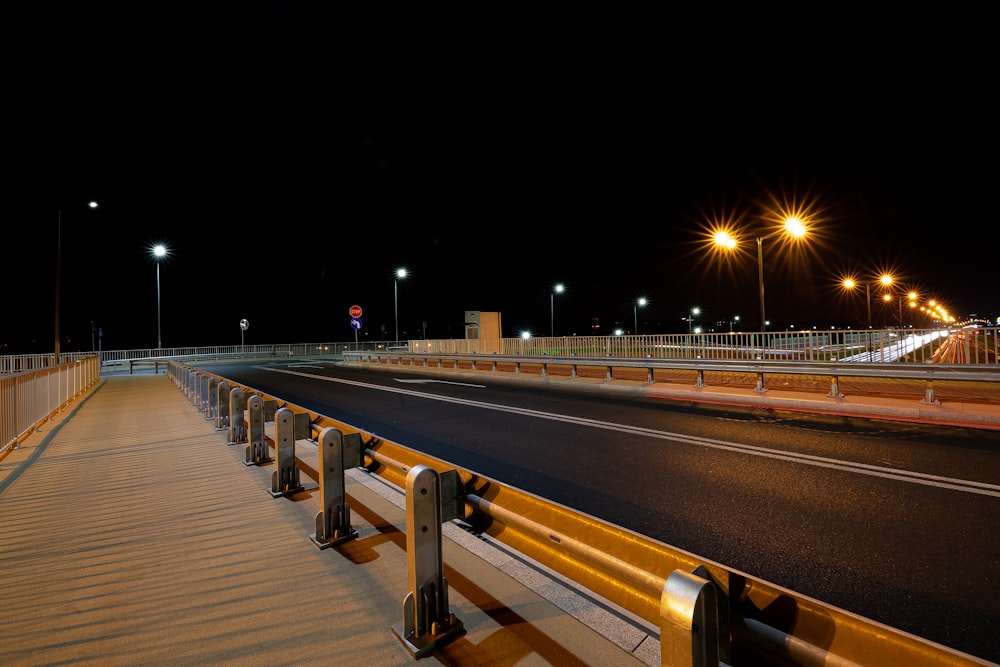 brown wooden bridge during night time