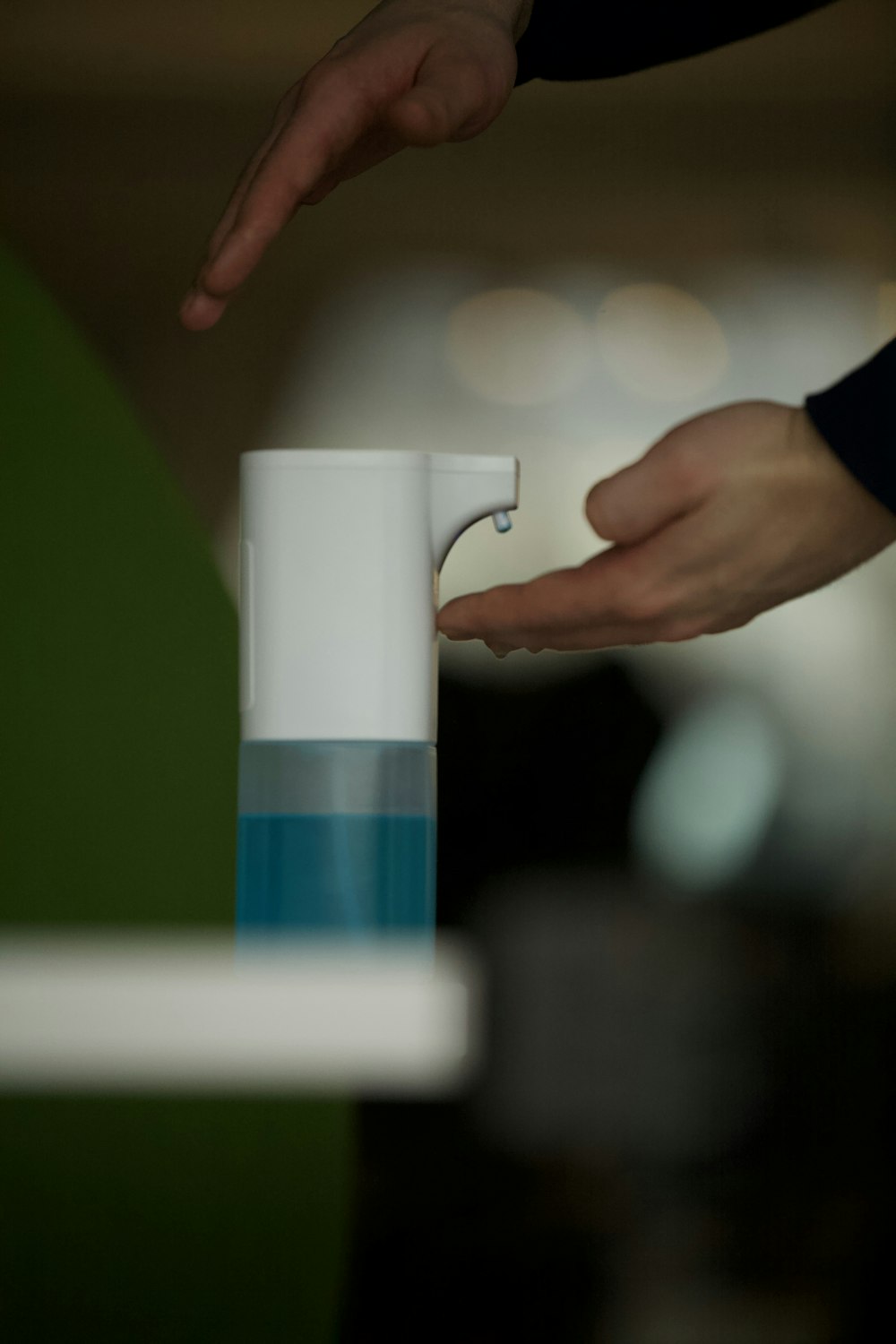 person holding white ceramic mug