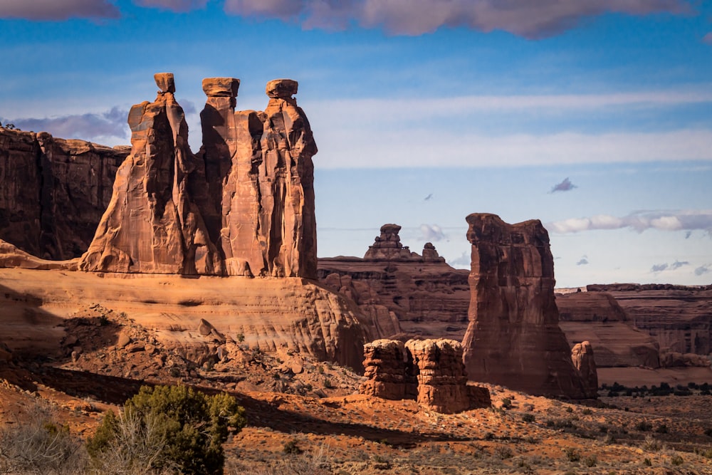 brown rock formation under blue sky during daytime