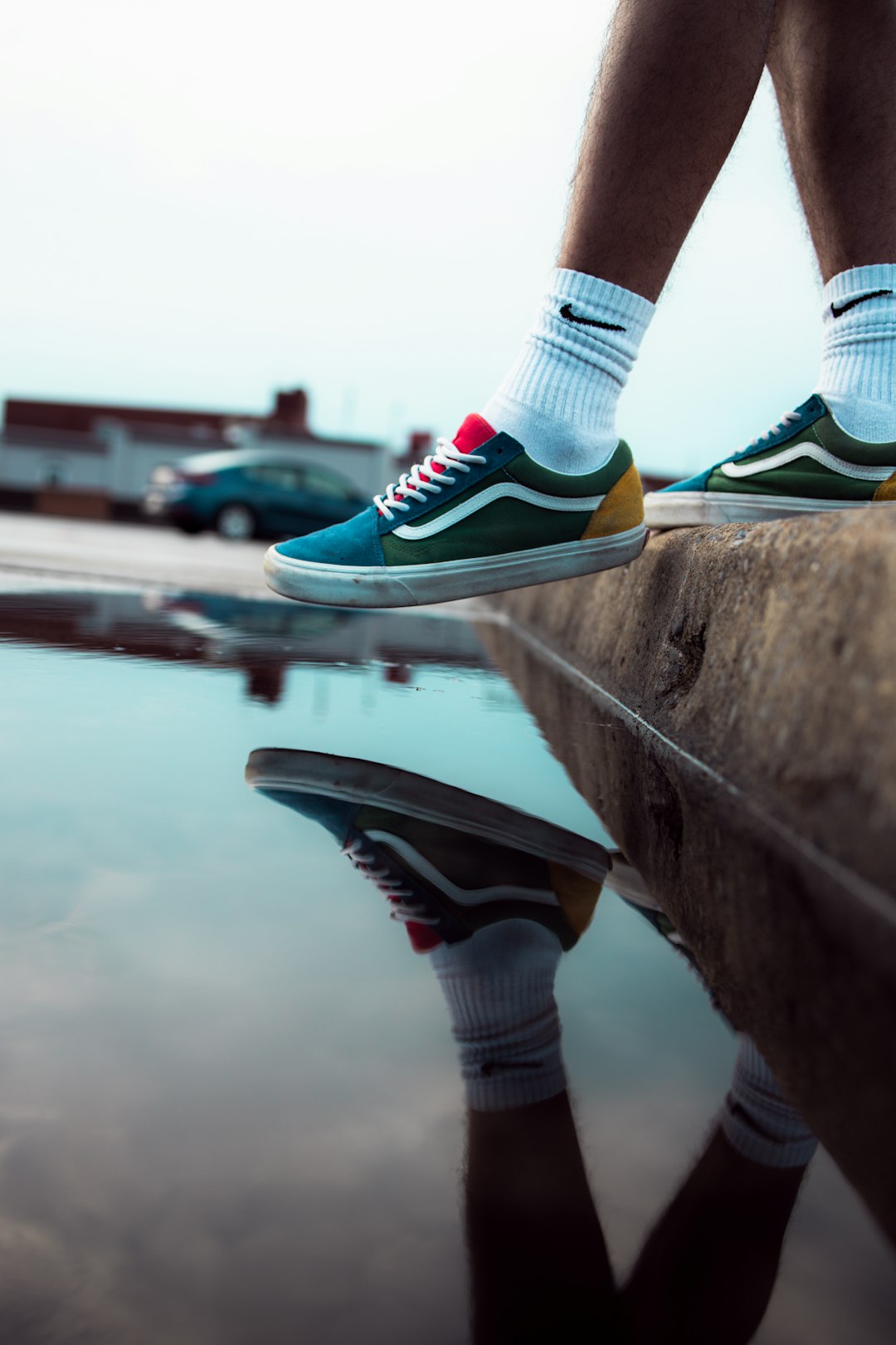 person wearing green and white nike sneakers