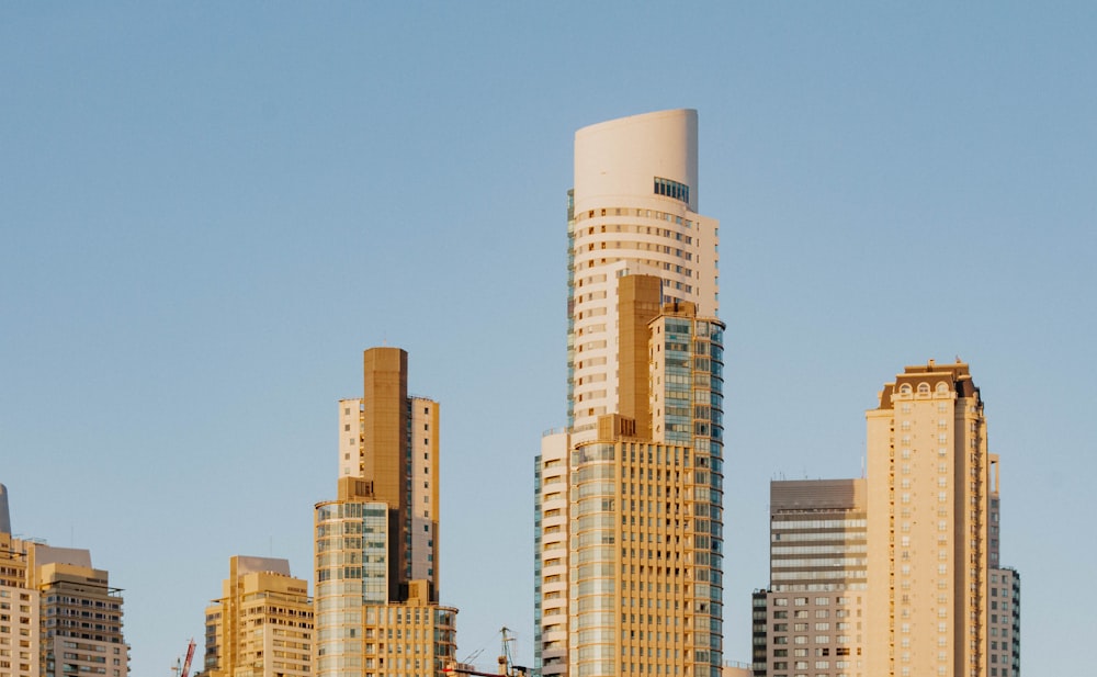 white concrete high rise building under blue sky during daytime