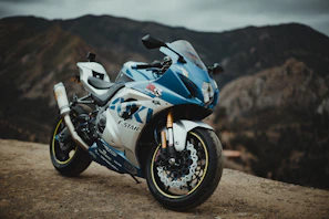 Side view of a modern Honda motorcycle with mountains in the background