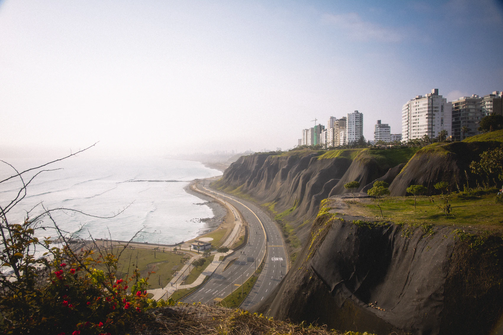 A white coastal building above the water in Lima