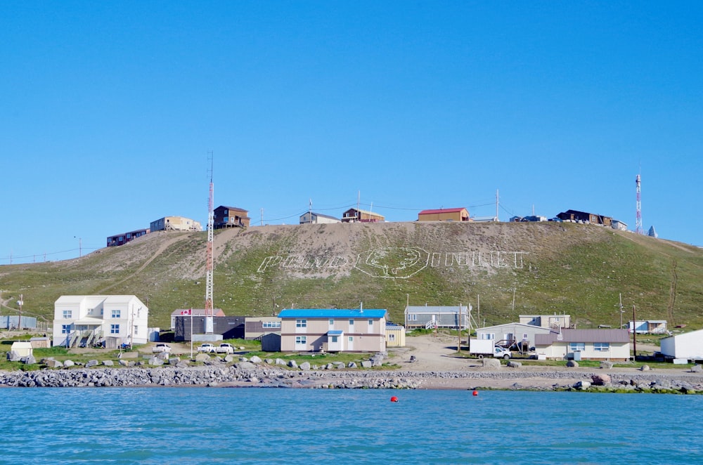 houses near body of water during daytime