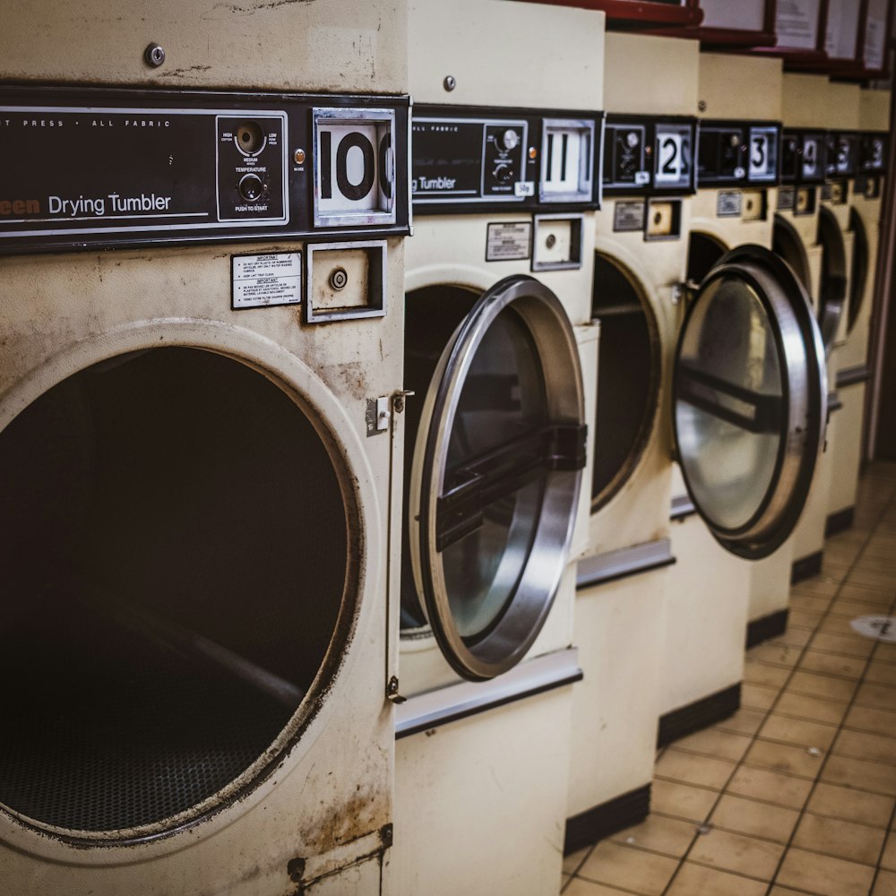 white and silver front load washing machine