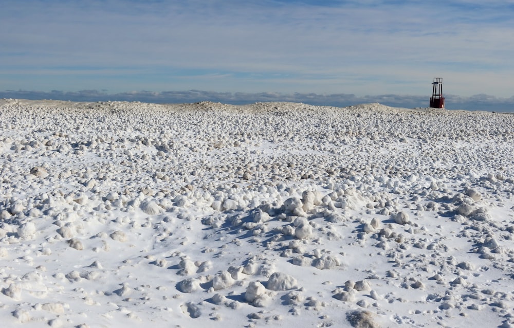 snow covered field under blue sky during daytime