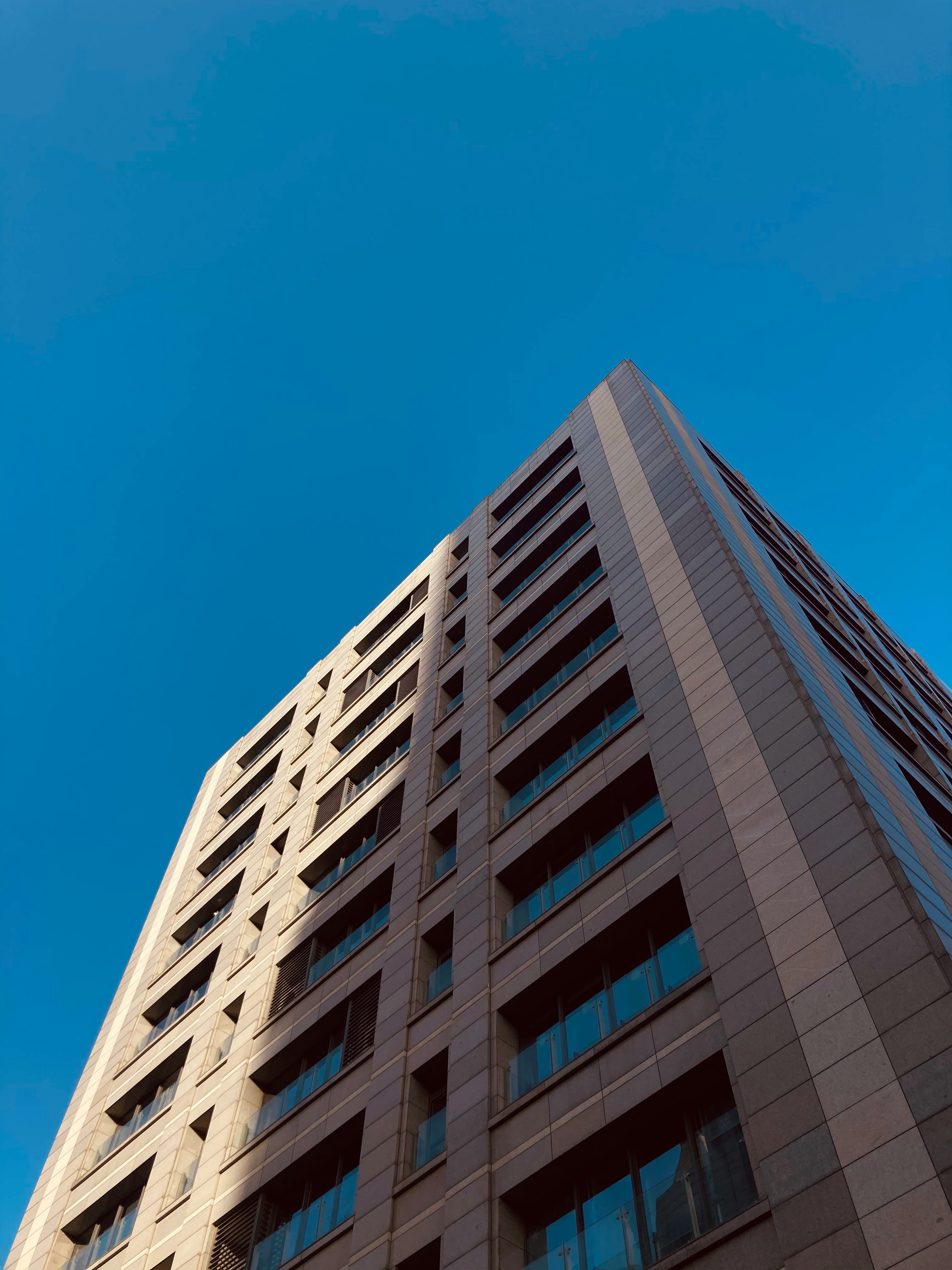 white and brown concrete building under blue sky during daytime