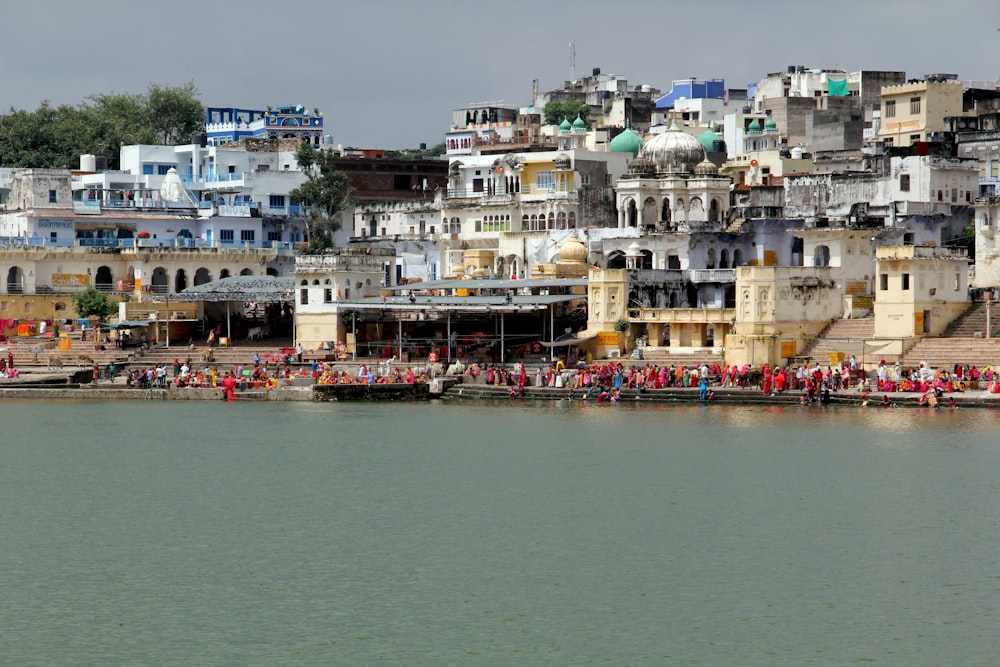 body of water near city buildings during daytime