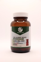 A brown glass bottle with a white cap contains CBD gummy bears. The label indicates THC-free broad-spectrum extract with 1350 mg of CBD. The flavor is delightful watermelon, and there are 30 gummies per bottle.