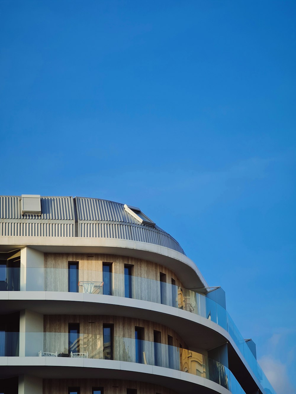 white and gray concrete building under blue sky during daytime