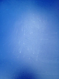 Texture of deep midnight blue stone with subtle golden veins.