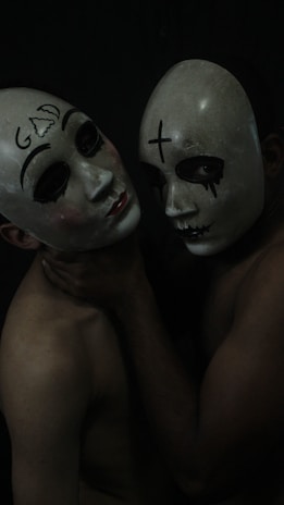 2 person with black and white mask