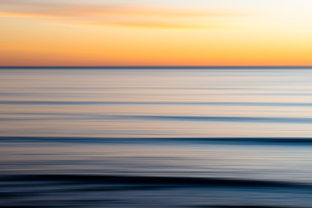 body of water during sunset