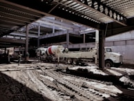 A construction site with heavy machinery and workers collaborating.