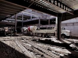 Construction site with heavy machinery and engineers coordinating with walkie-talkies.