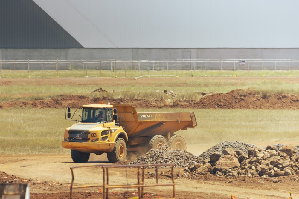 brown single cab pickup truck on brown field during daytime