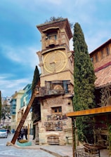 brown concrete building with clock tower