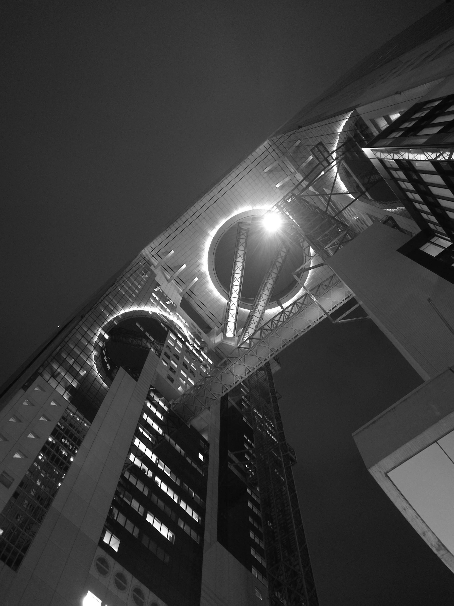 A crisp, high-quality photograph capturing the intricate details of a futuristic architectural structure glowing under soft ambient light.