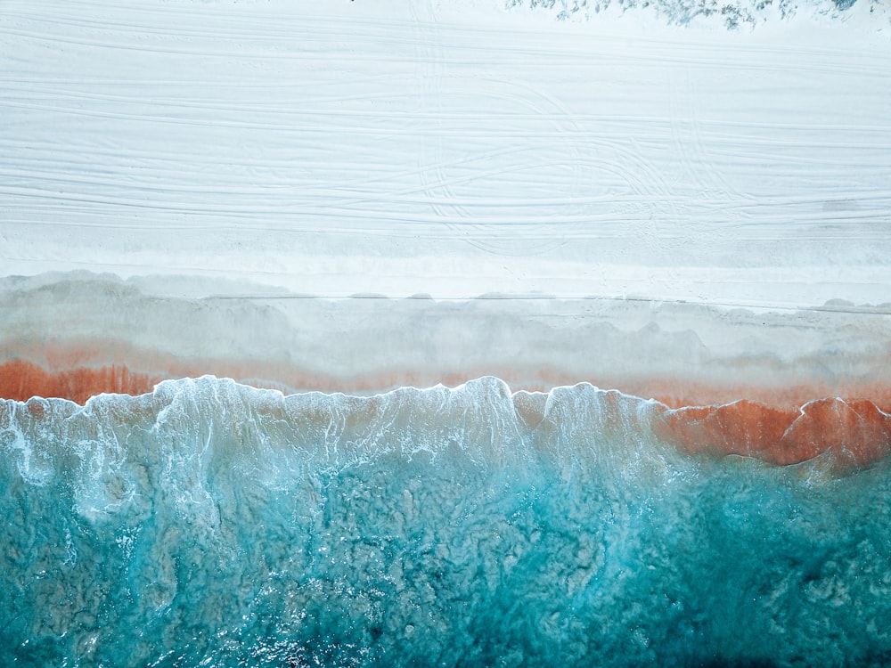 white and blue ocean waves