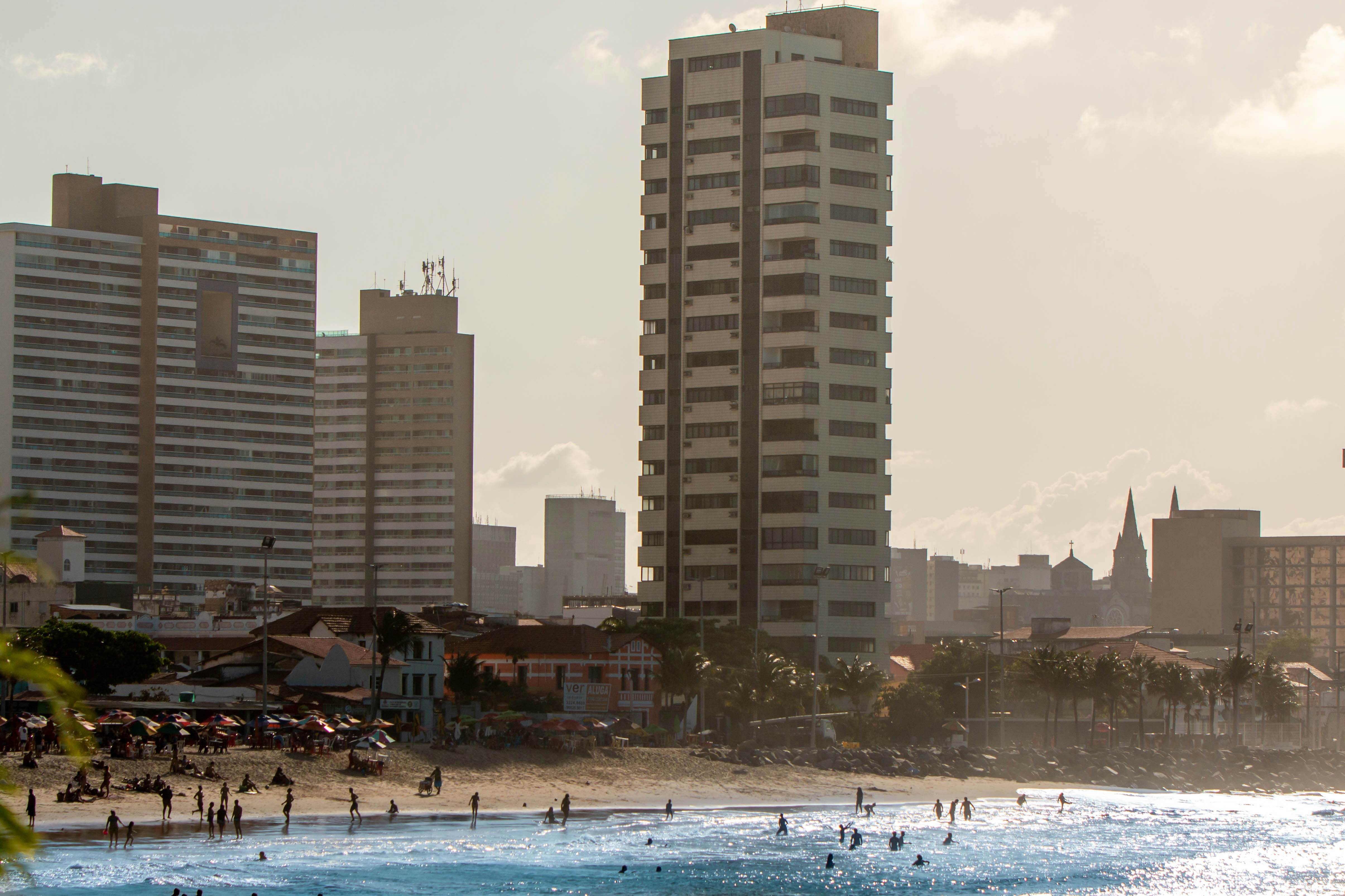 People on beach near high rise buildings during daytime photo – Free ...