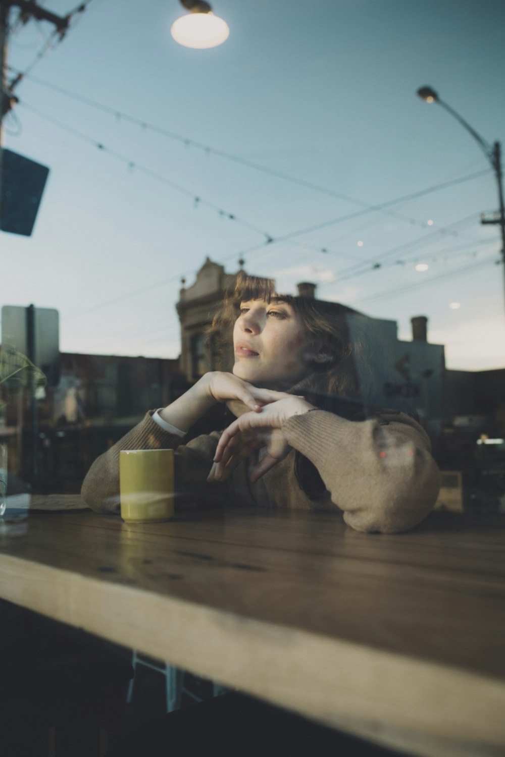 woman in black long sleeve shirt sitting on chair