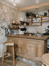 Cozy interior of Vault Coffee showing the old bank vault and rustic wooden tables with plates of food and coffee cups.
