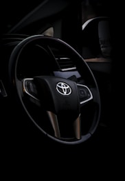 black and silver mercedes benz steering wheel