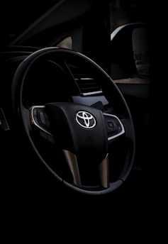black and silver mercedes benz steering wheel