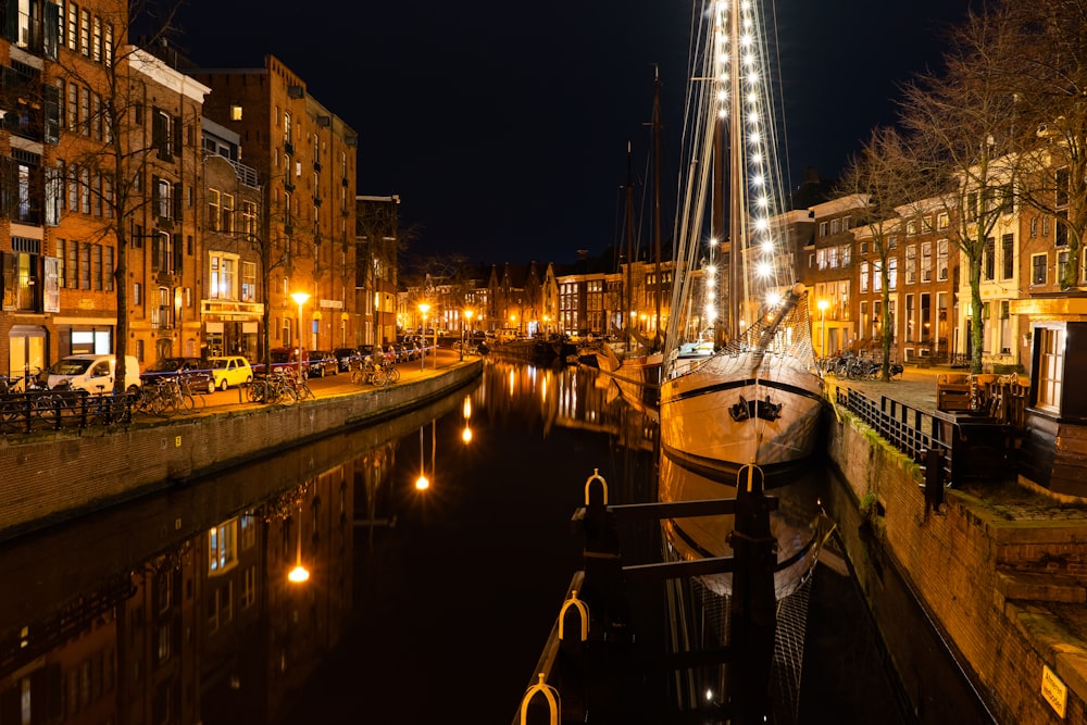 white boat on dock during night time