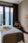 A cozy massage room with soft lighting and a comfortable massage table.