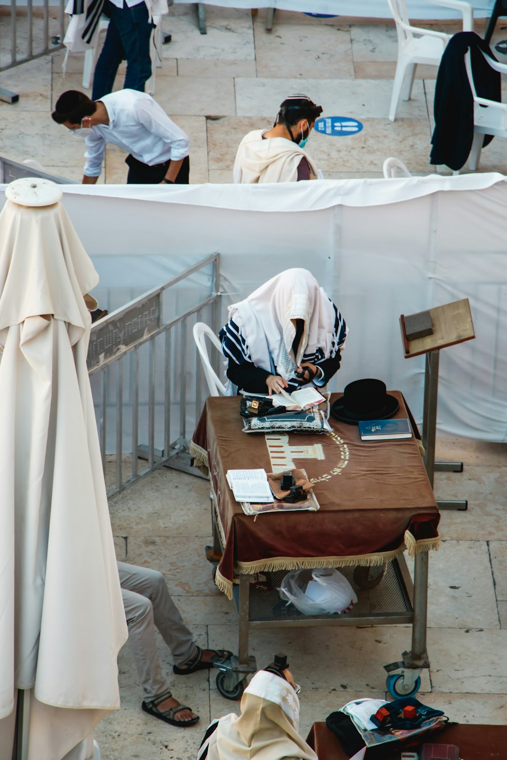 brown wooden table with white textile on top