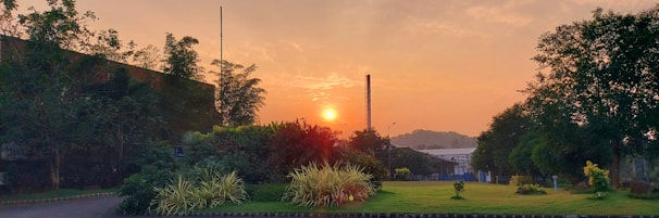 A sunrise over an industrial site symbolizing new beginnings and growth.