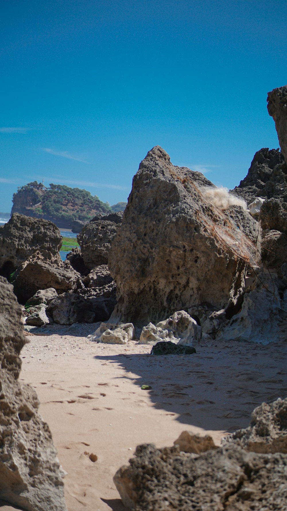 brown rock formation on beach during daytime