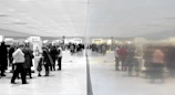 A panoramic view of the exhibition space showcasing multiple large-format artworks