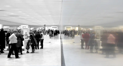 A panoramic view of the exhibition space showcasing multiple large-format artworks