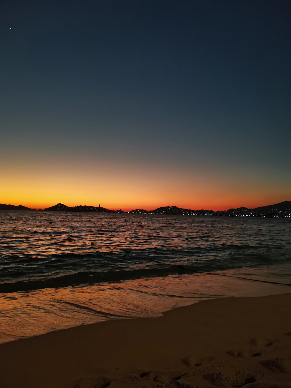 body of water during sunset