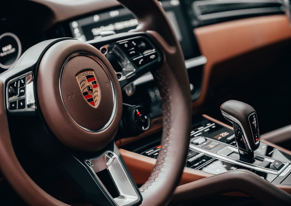 black and brown nissan steering wheel