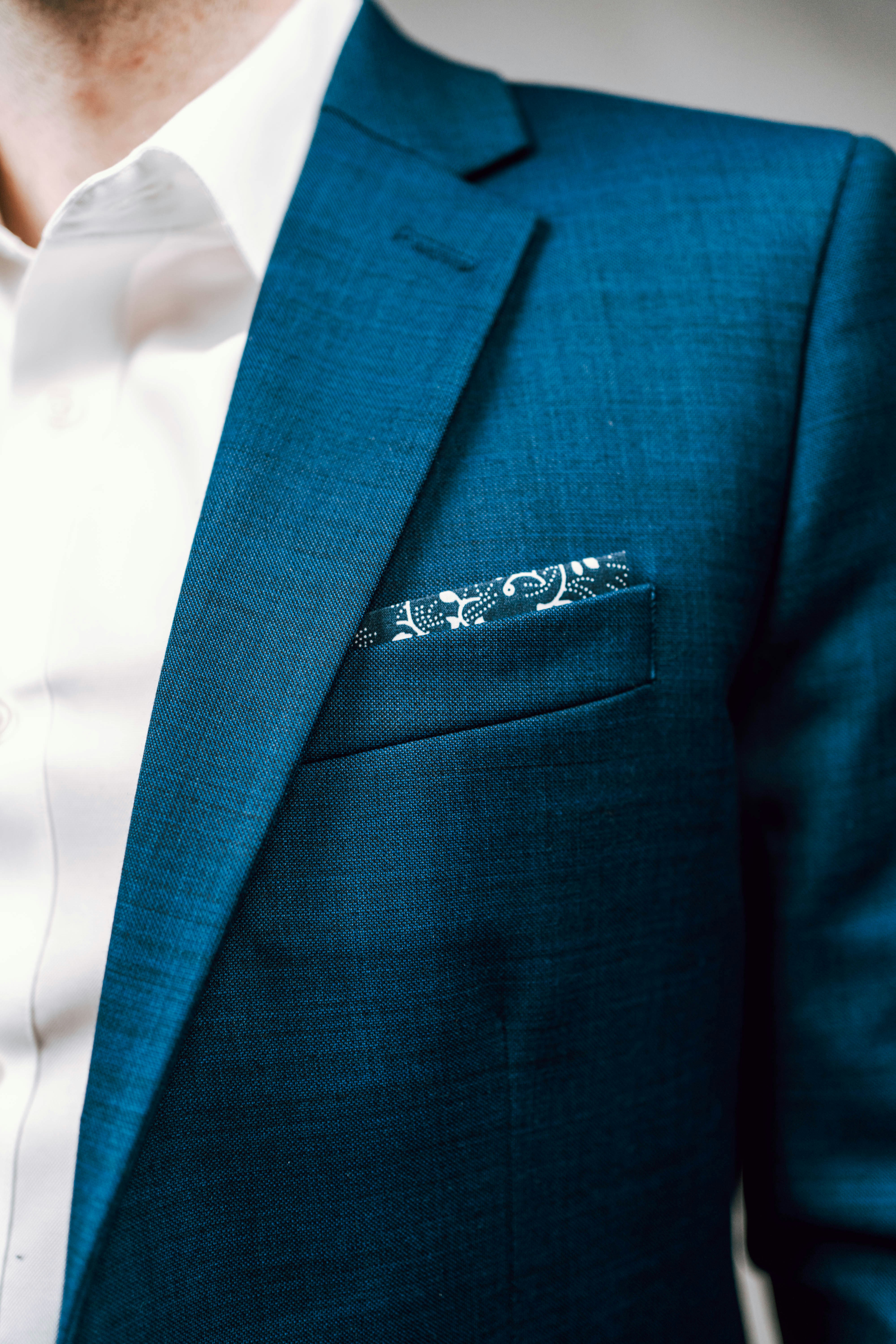 man in green suit jacket