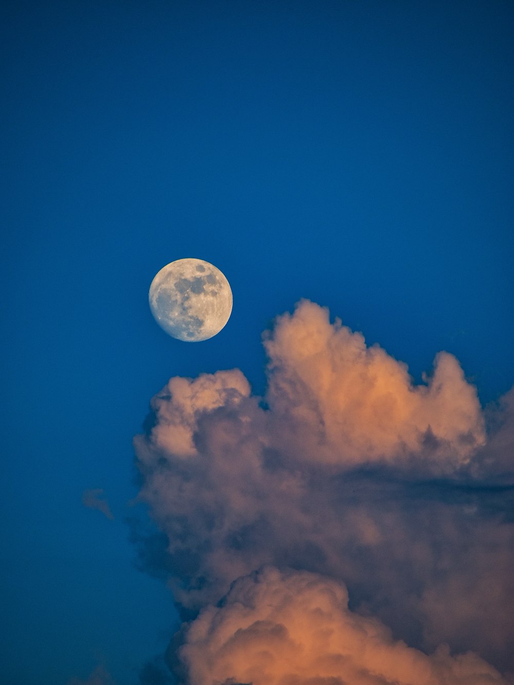 full moon in blue sky