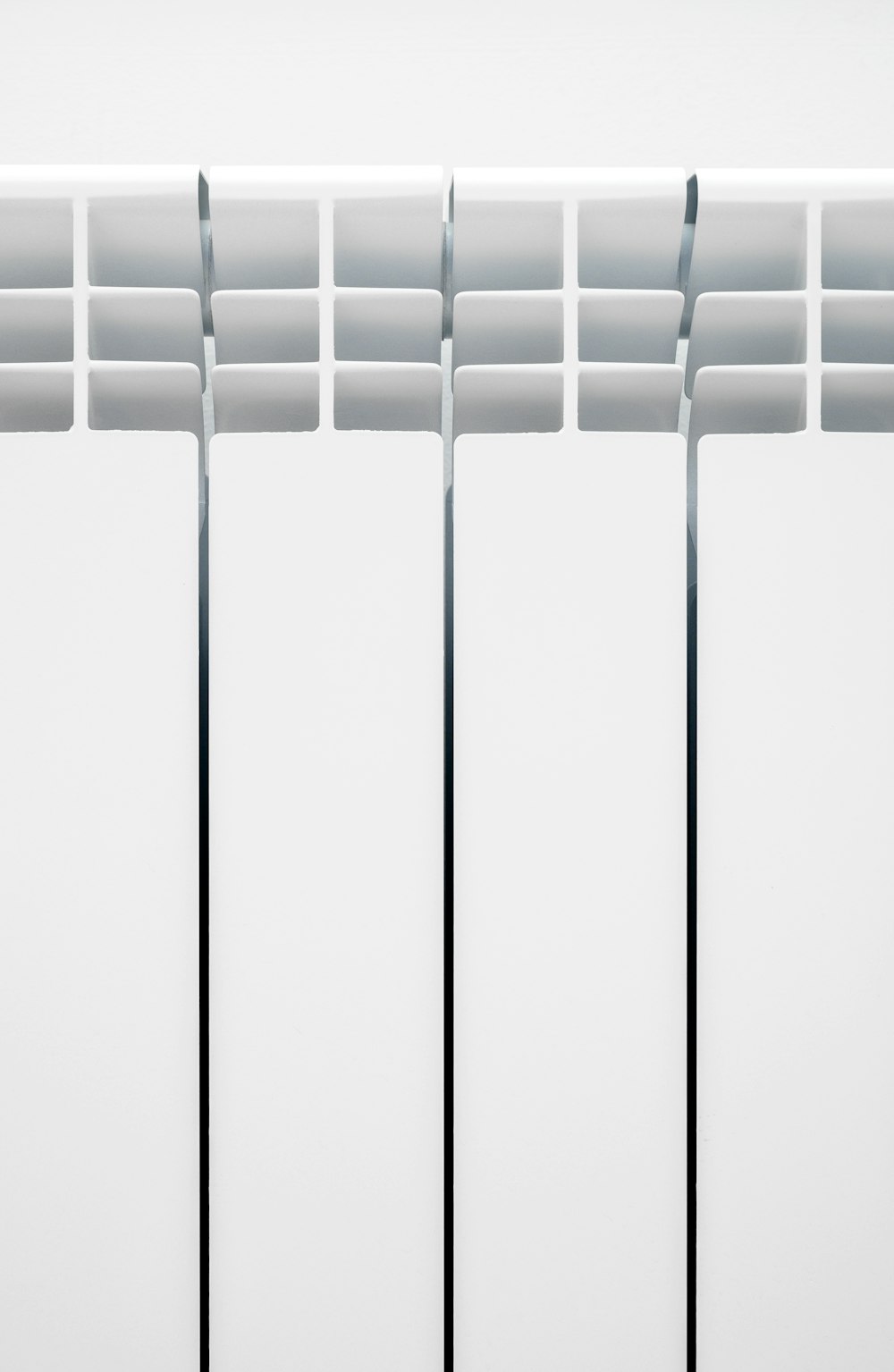 white window blinds on white wall