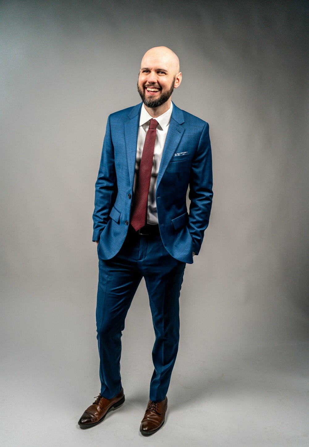 man in blue suit standing