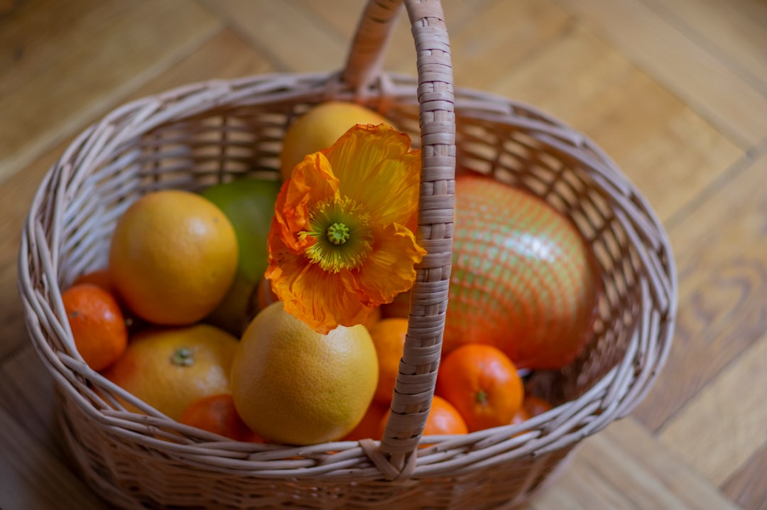 orange fruits on brown woven basket