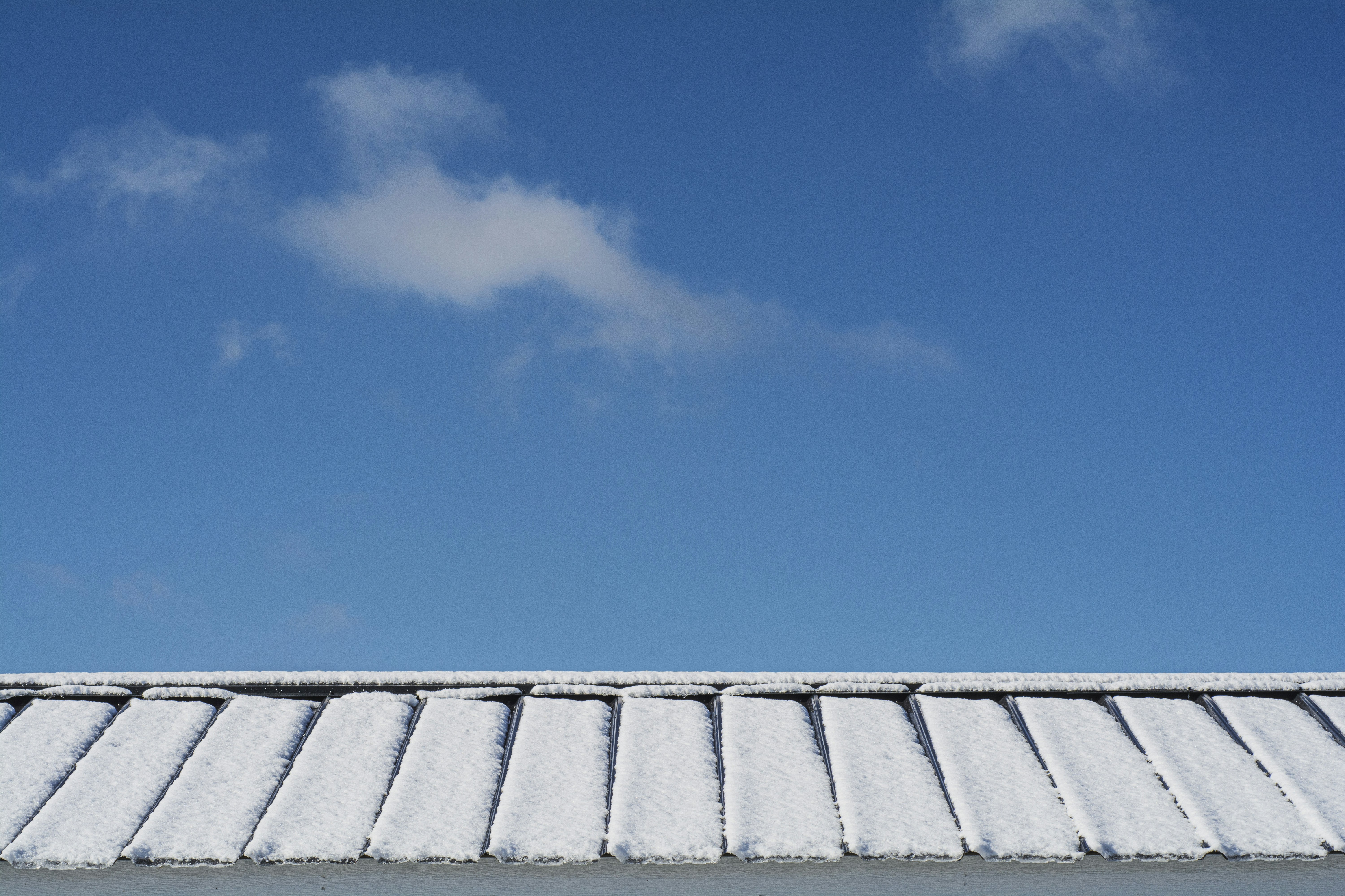 gray roof under blue sky during daytime
