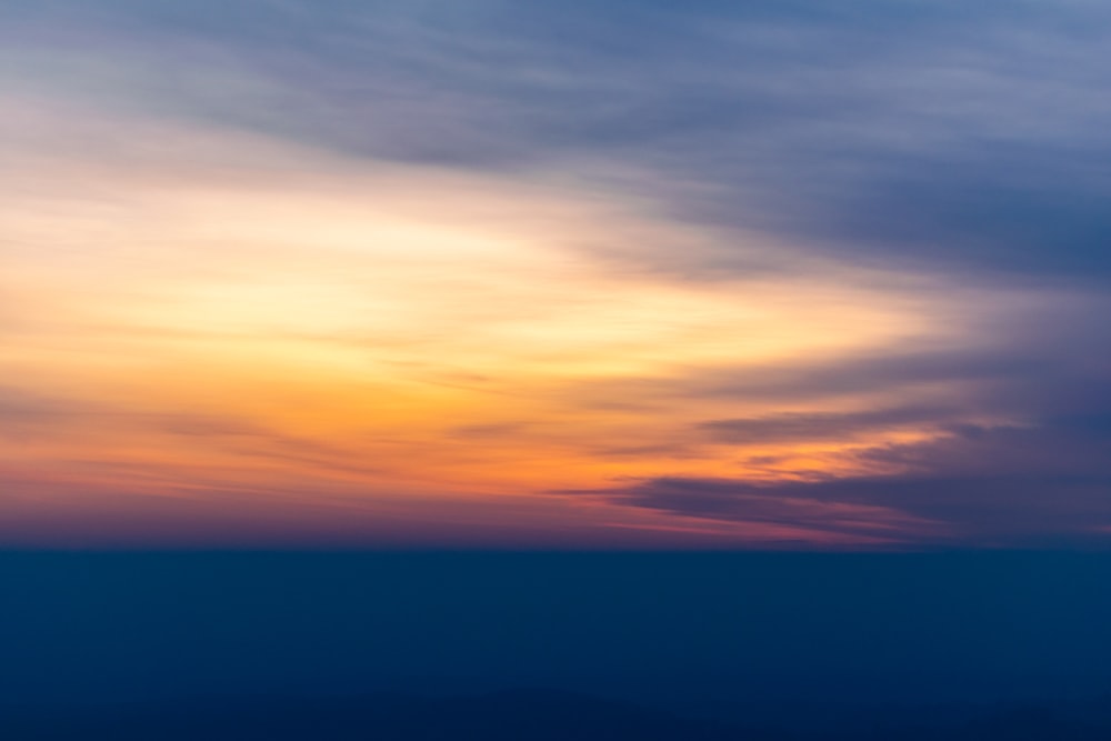 blue and orange cloudy sky during sunset