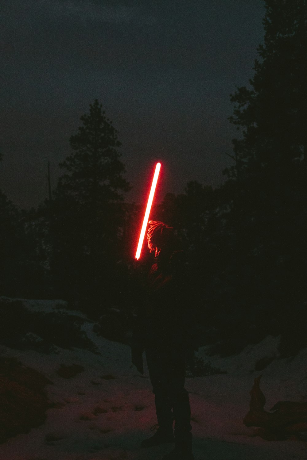 red light in the sky during night time