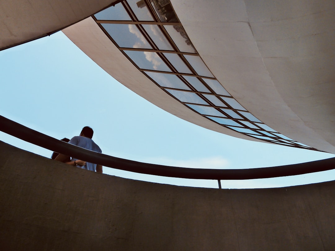 people walking on spiral staircase