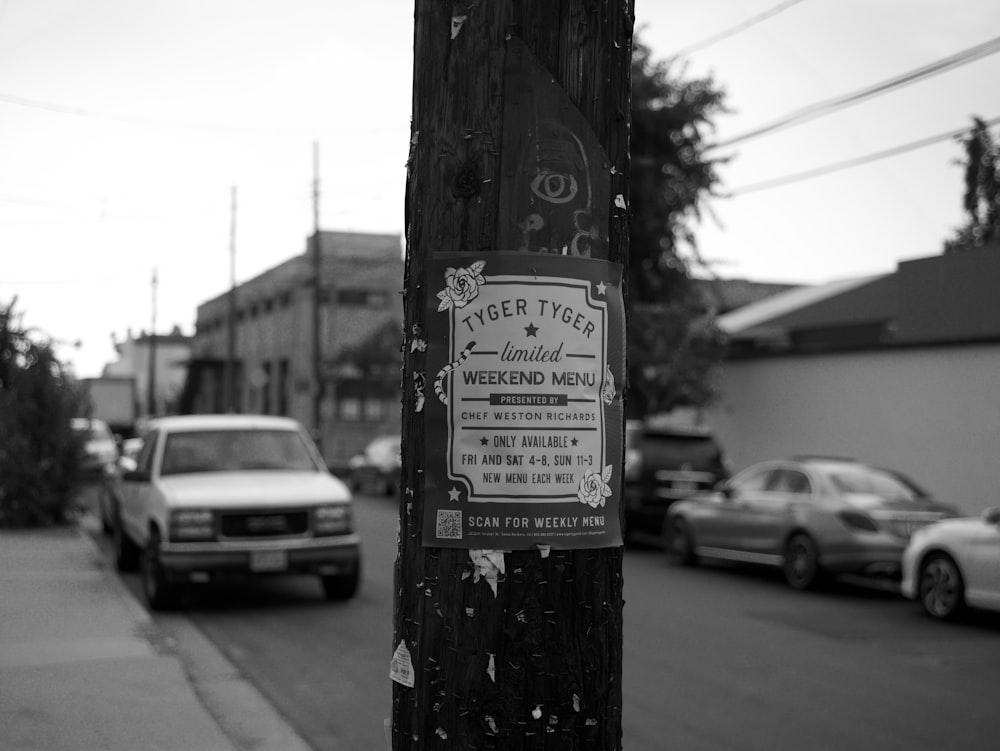 grayscale photo of wooden post