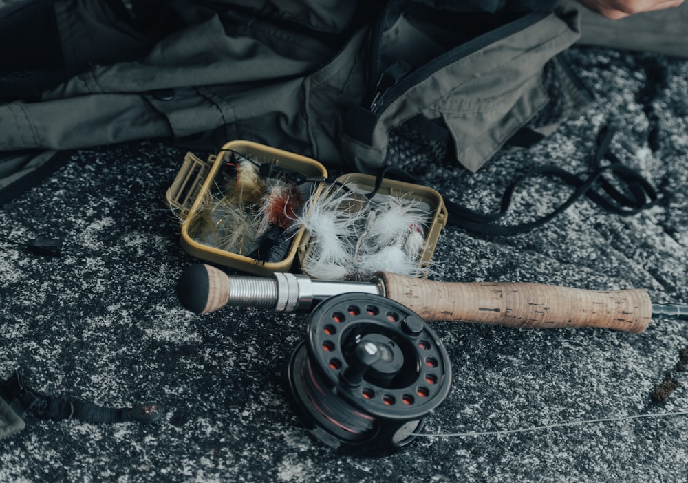 black and brown fishing reel