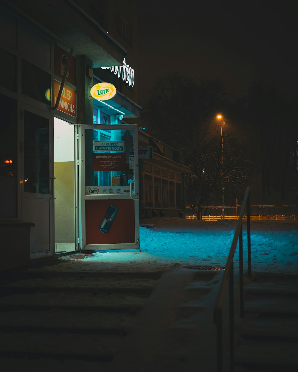 white and red store front during night time