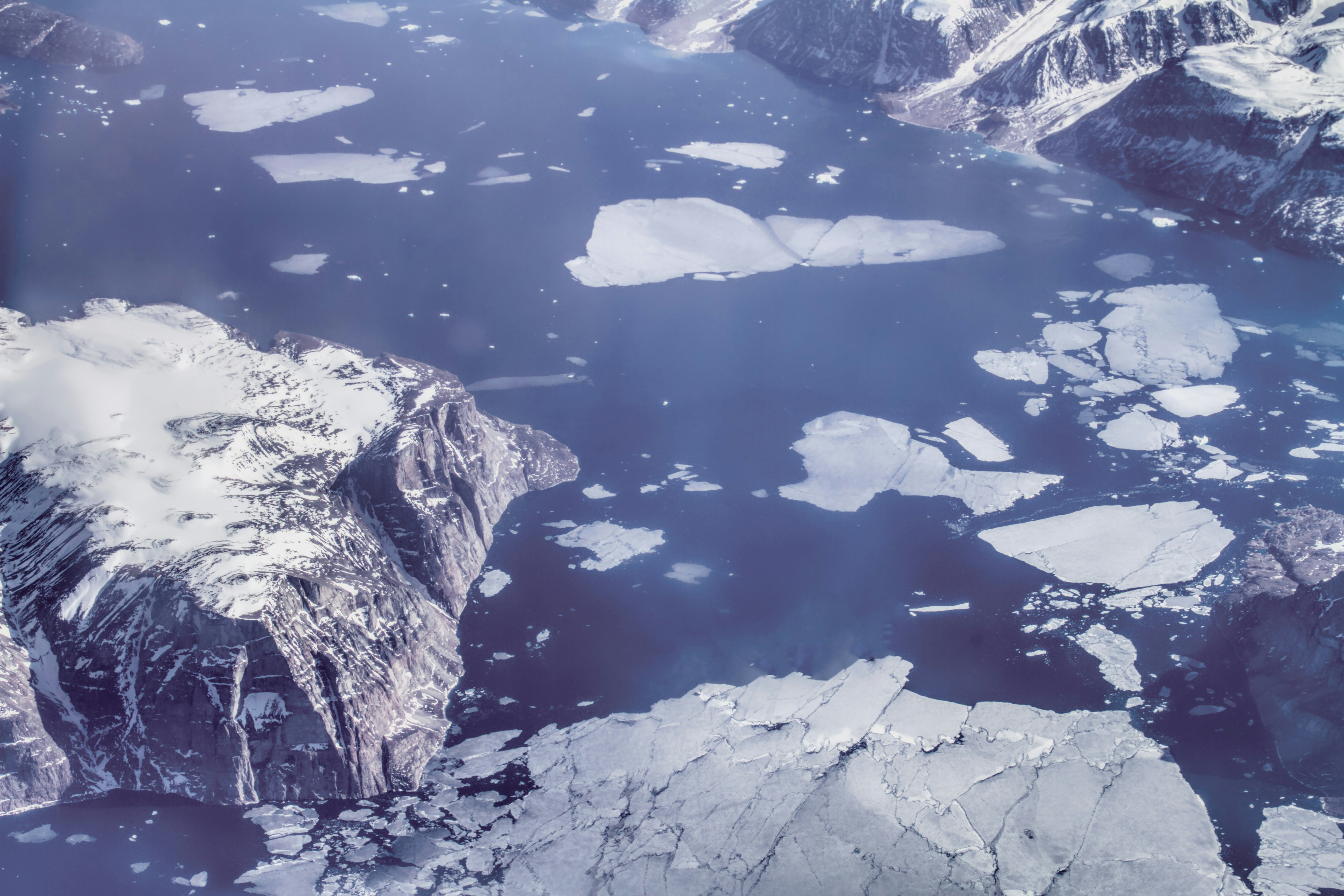 aerial view of lake between mountains during daytime